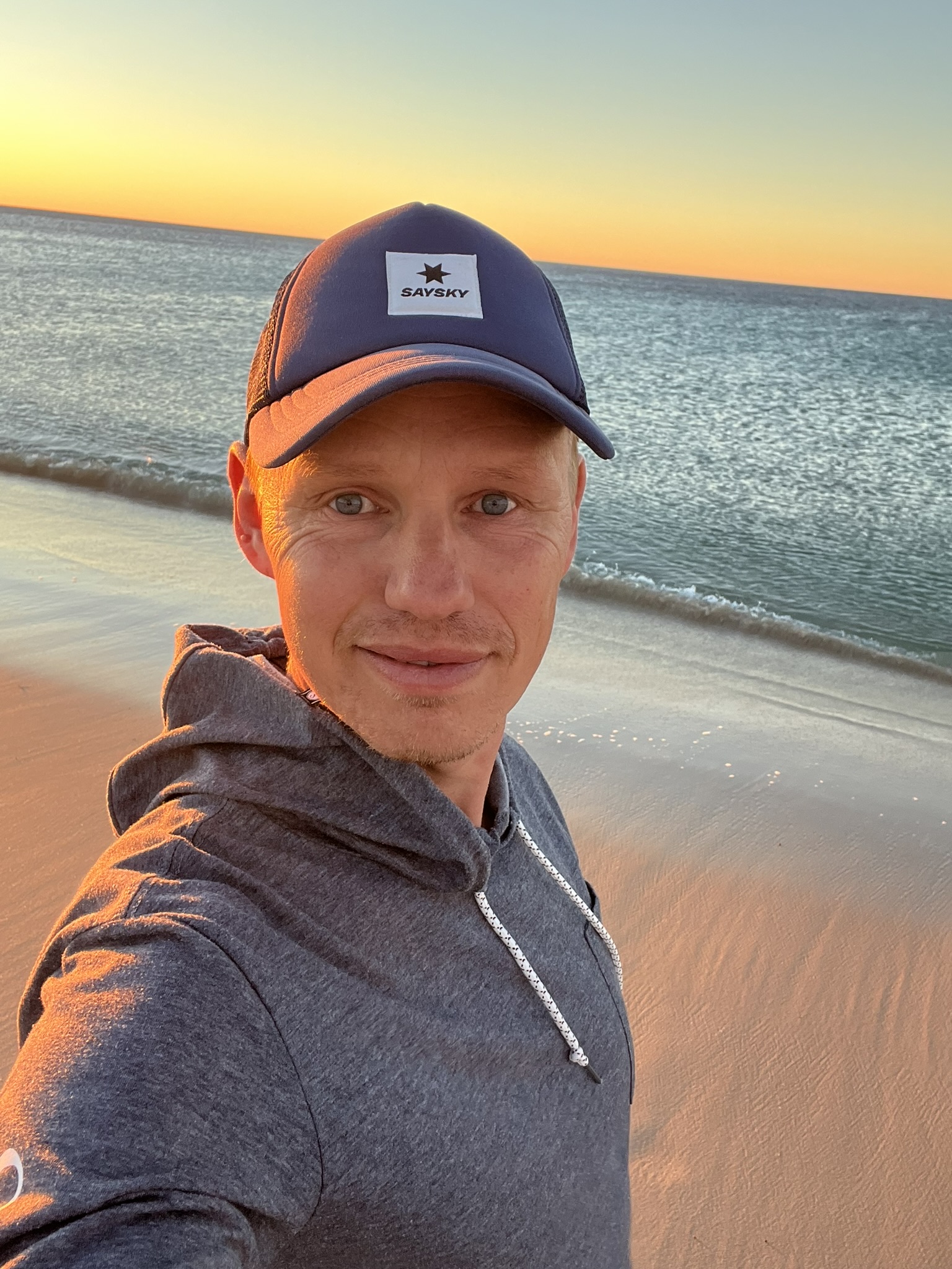 Mathias Iversen on the beach at sunset